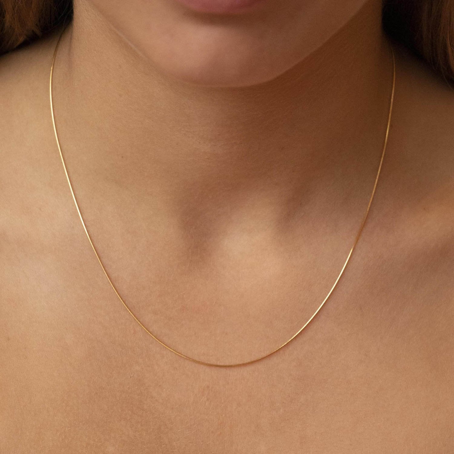 9K Yellow Gold Mini Round Snake Chain 50cm Model Image