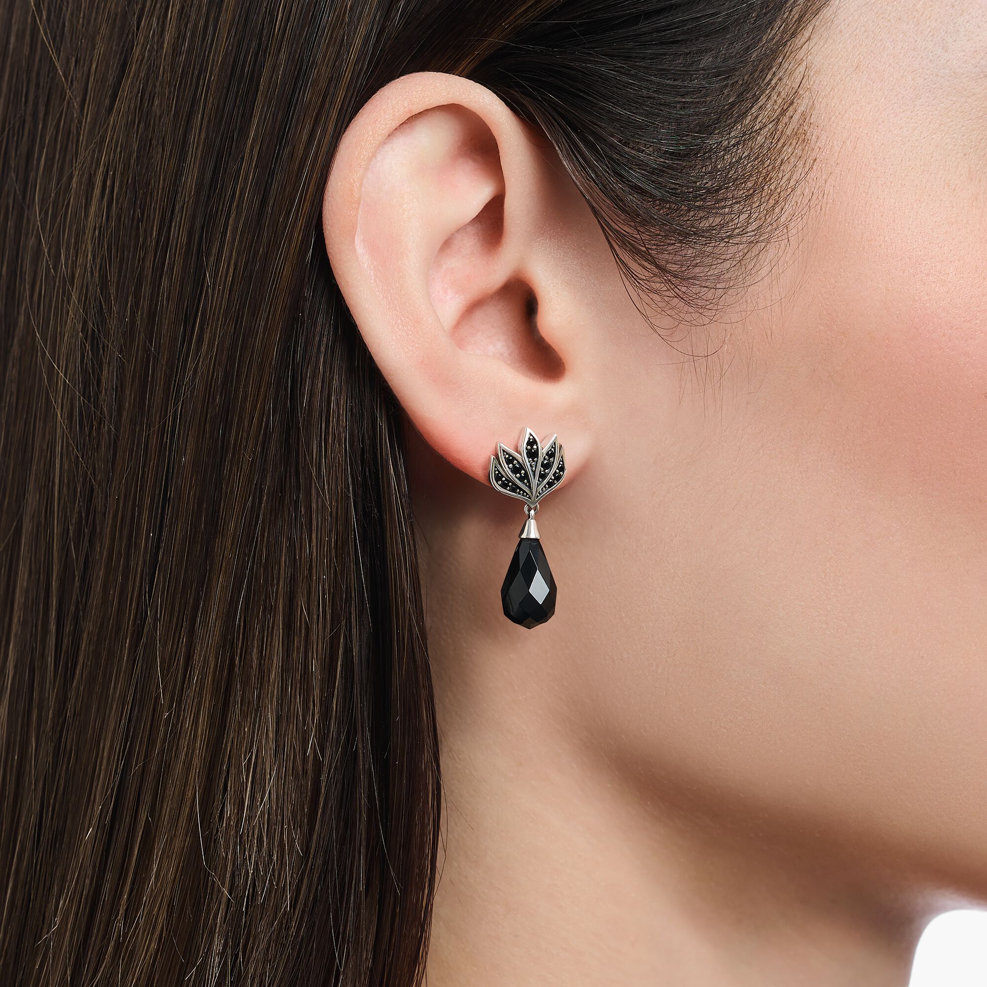 Blackened ear studs with drop-shaped