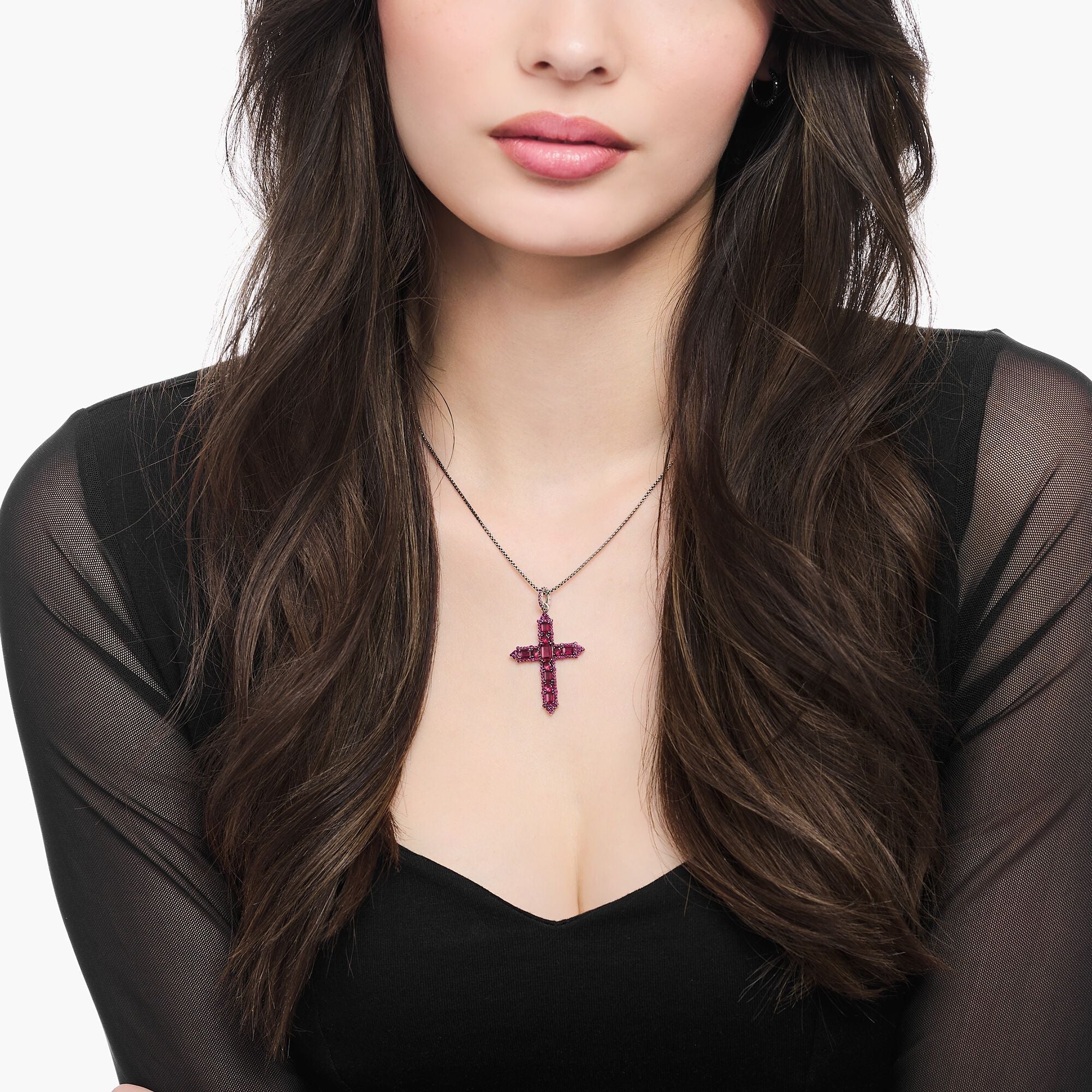 Blackened cross pendant with ruby red stones